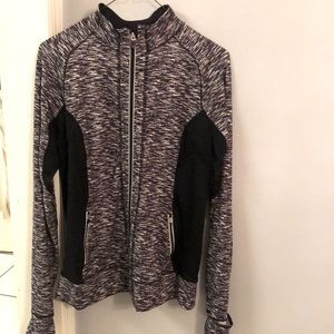 Reva athletic zip up sweat jacket. Black and white design. Zip pockets. L